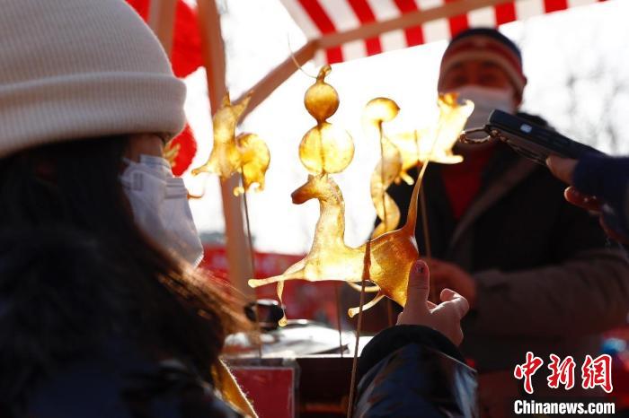 “年花丰食大集”开市美食、花卉、非遗表演添年味儿
